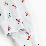 Close-up of cuff and hem on white pajamas with musician print