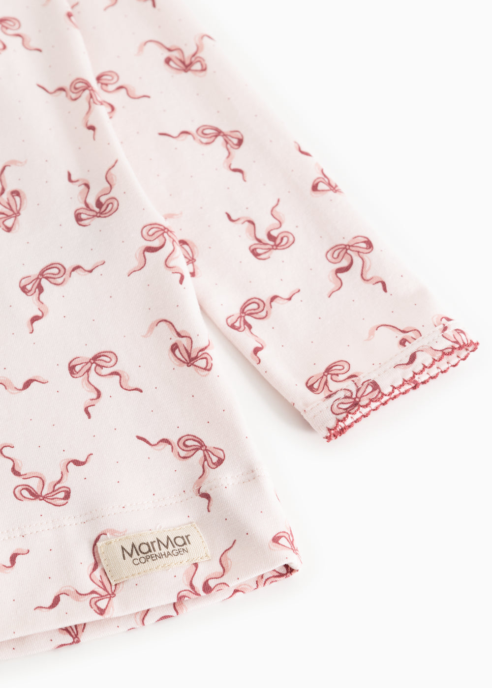 Nightgown with red bow print on light fabric and MarMar label at the edge