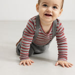 Bodystocking with long sleeves in gray and cherry red stripes, worn by baby