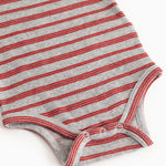 Bodystocking in gray and cherry red stripes with ribbed edges and snap button detail