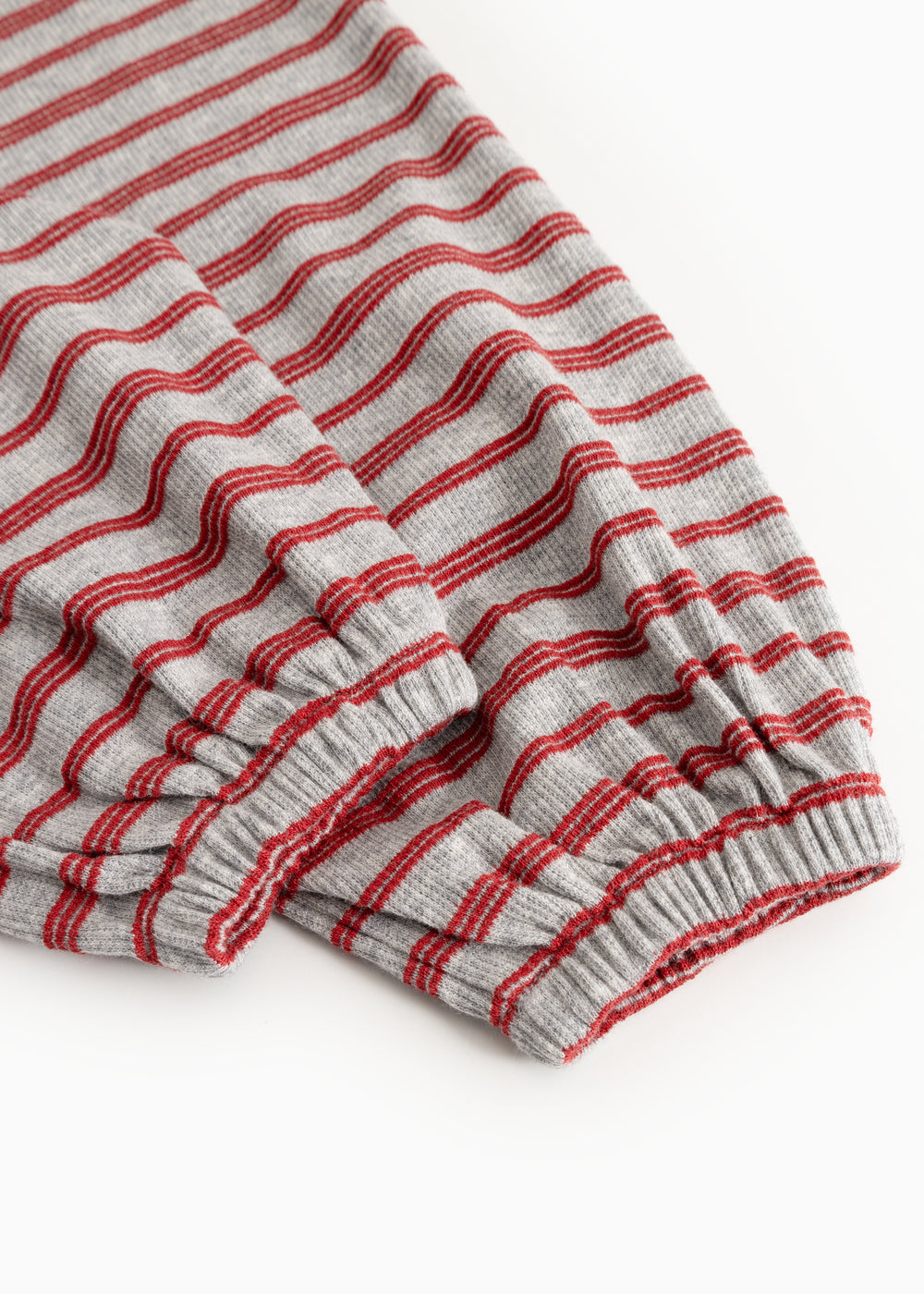 Gray and red striped romper with elastic hem and gathered leg openings