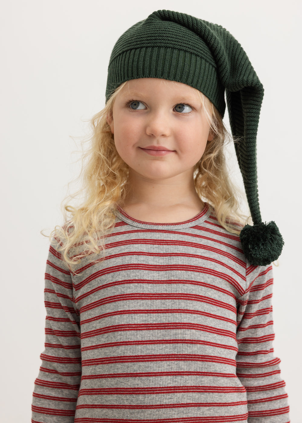 Dark green knitted elf hat with pompom on child