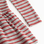 Detail of red and white striped fabric with gathered hem