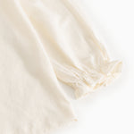 Offwhite blouse with puff sleeves and elastic cuff