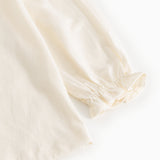 Offwhite blouse with puff sleeves and elastic cuff