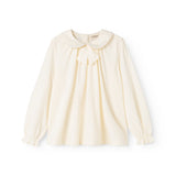 Off-white blouse with ruffle collar, button closure and puff sleeves