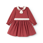 Burgundy dress with white collar, embroidery and bow detail, long puff sleeves.