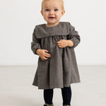 Houndstooth dress in brown-blue check with ruched bodice panel and long sleeves