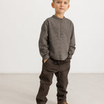 Children's pants in dark brown on boy, loose legs with belt loops