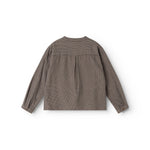 Close-up of long-sleeve shirt back panel in houndstooth pattern
