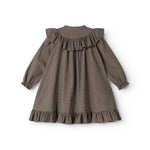 Children's dress with pied de poule pattern, ruffles at the neckline and flounced skirt.