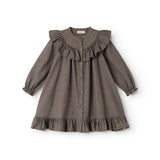 Children's dress with pied de poule pattern, button closure, and ruffle trim at collar and sleeves.