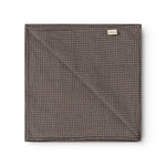 Airo scarf with brown and blue houndstooth pattern, folded square