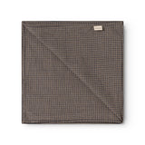 Airo scarf with brown and blue houndstooth pattern, folded square