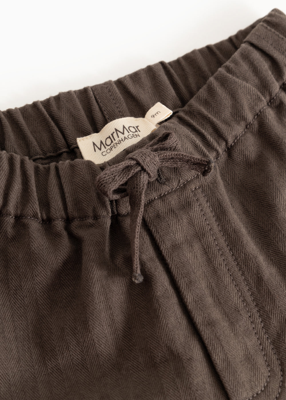 Brown baby pants with elastic waistband and drawstring