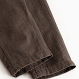 Brown baby pants with stitching on the pant legs and straight legs