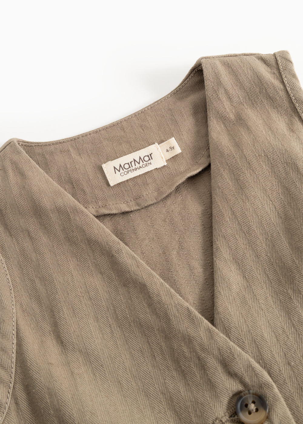 Brown boys' vest with collar and visible brand label at neck opening.