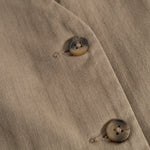 Brown boys' vest with buttons and diagonal pattern on the front fabric.