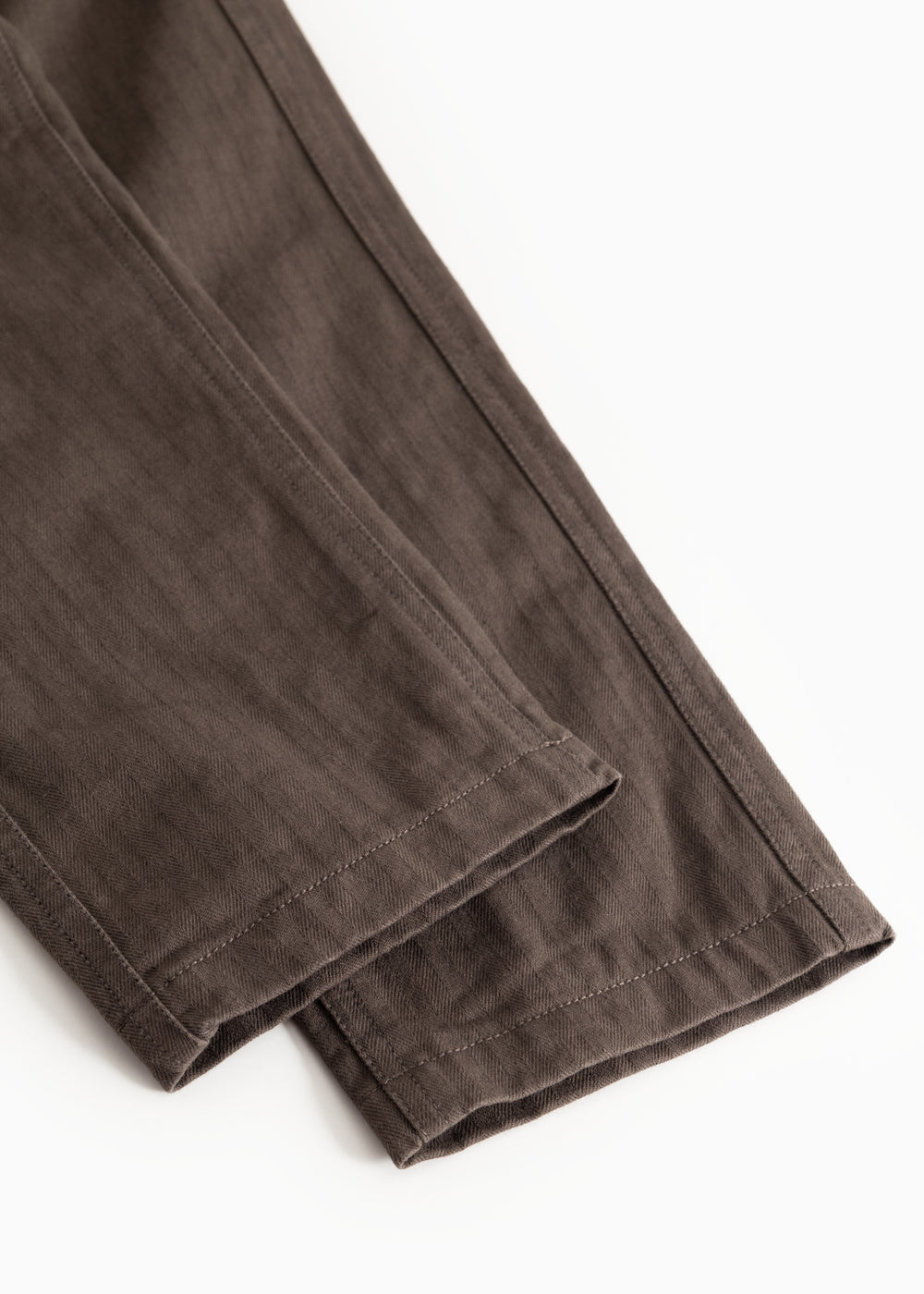 Children's pants in dark brown with straight leg hem and visible seam