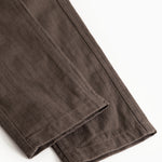 Children's pants in dark brown with straight leg hem and visible seam