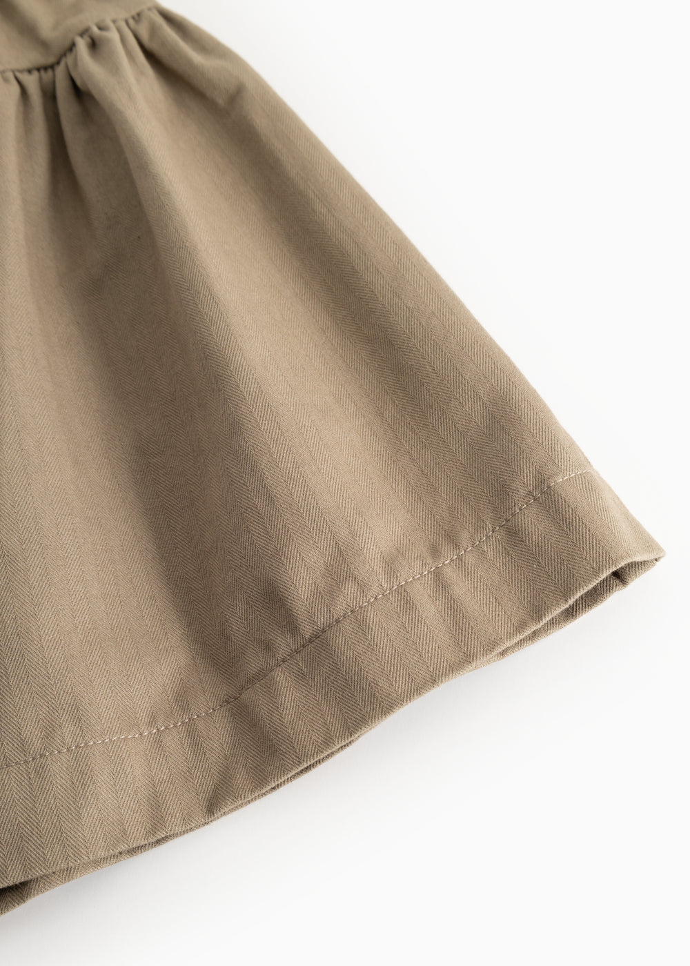 Brown skirt with visible seam at hem