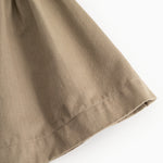 Brown skirt with visible seam at hem