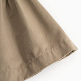 Brown skirt with visible seam at hem
