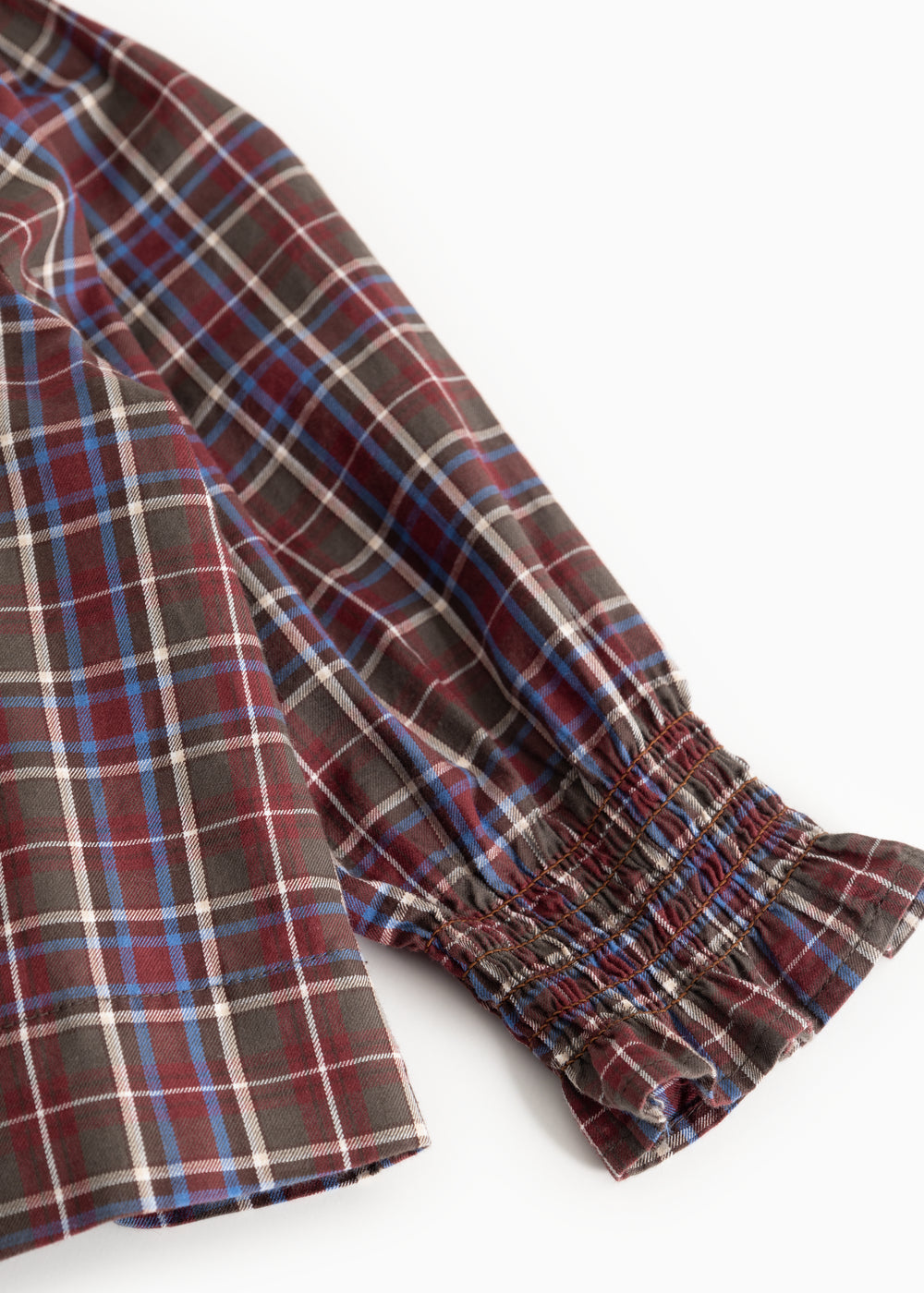 Children's blouse sleeve with checkered fabric and elastic cuff