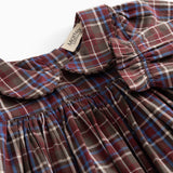 Tiered dress: collar and button closure at front with smocking detail at neckline