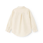 Children's shirt in light cream with button closure and rounded hem at the back