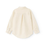 Children's shirt in light cream with button closure and rounded hem at the back