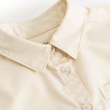 Light cream shirt collar with button placket and visible buttons