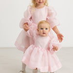 Pink tulle dress with voluminous sleeves and layered skirt