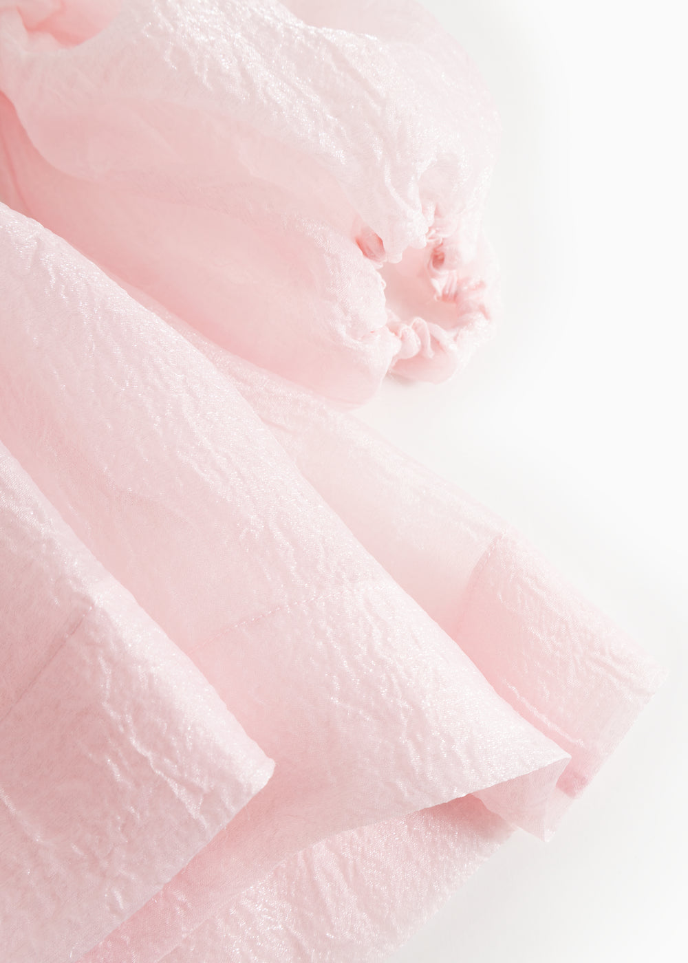 Pink tulle dress with puff sleeves and gathered detail at the cuff