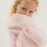Pink dress with large tulle sleeve and soft ruffle at the upper body