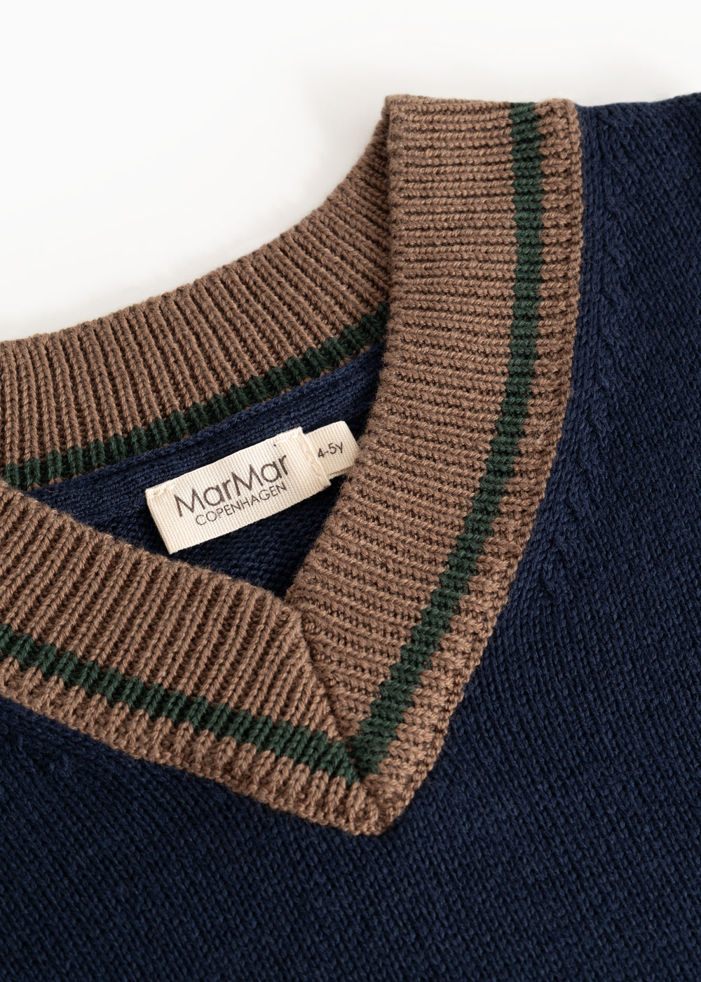 Dark blue V-neck knit sweater with brown stripes and 'MarMar Copenhagen' label.