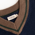 Dark blue V-neck knit sweater with brown stripes and 'MarMar Copenhagen' label.