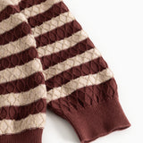 Knitted sweater with brown-red and cream stripes and ribbed cuffs at the sleeves