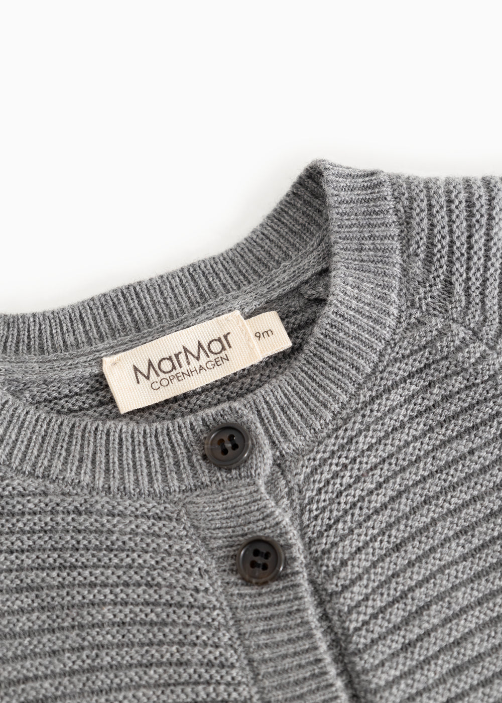 Gray knitted cardigan with ribbed edges, buttoned placket, and MarMar Copenhagen label