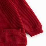 Red knitted cardigan with ribbed cuffs and hem