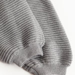 Knitted grey melange trousers with ribbed cuffs at the bottom