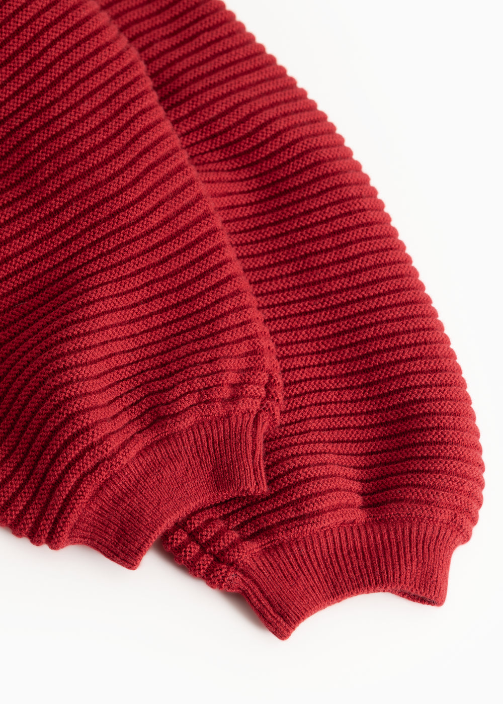 Red knit pants: ribbed cuff at leg opening and bottom hem