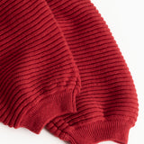 Red knit pants: ribbed cuff at leg opening and bottom hem