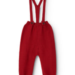 Red knitted baby pants with suspenders and buttons on the front