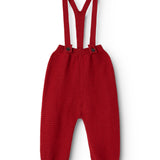 Red knitted baby pants with suspenders and buttons on the front