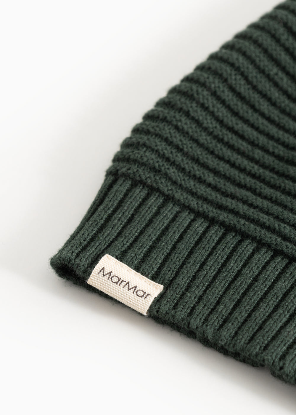 Knitted dark green elf hat with MarMar label and ribbed edge