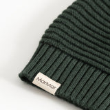 Knitted dark green elf hat with MarMar label and ribbed edge