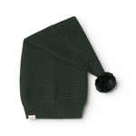 Knitted dark green elf hat with pompom and ribbed texture