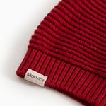 Alfen Santa hat: ribbed knit in cherry red with label at the bottom