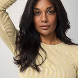 Woman wearing a long-sleeved t-shirt for women with green stripes